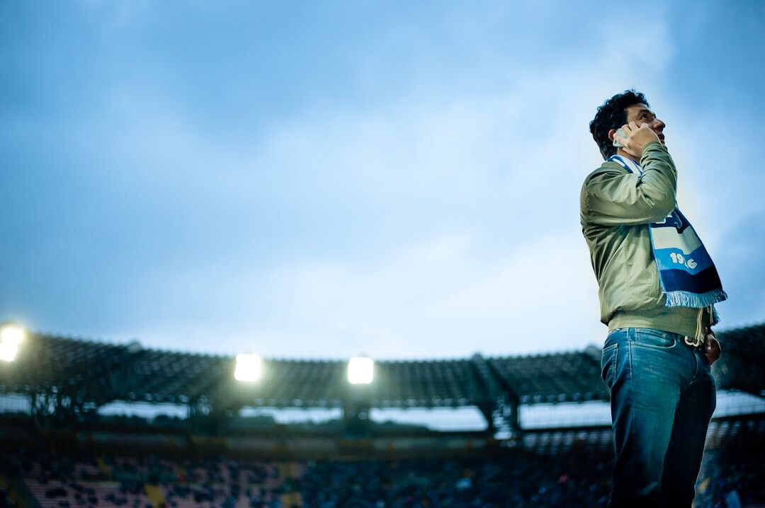 Portrait of a sports commentator holding a microphone
