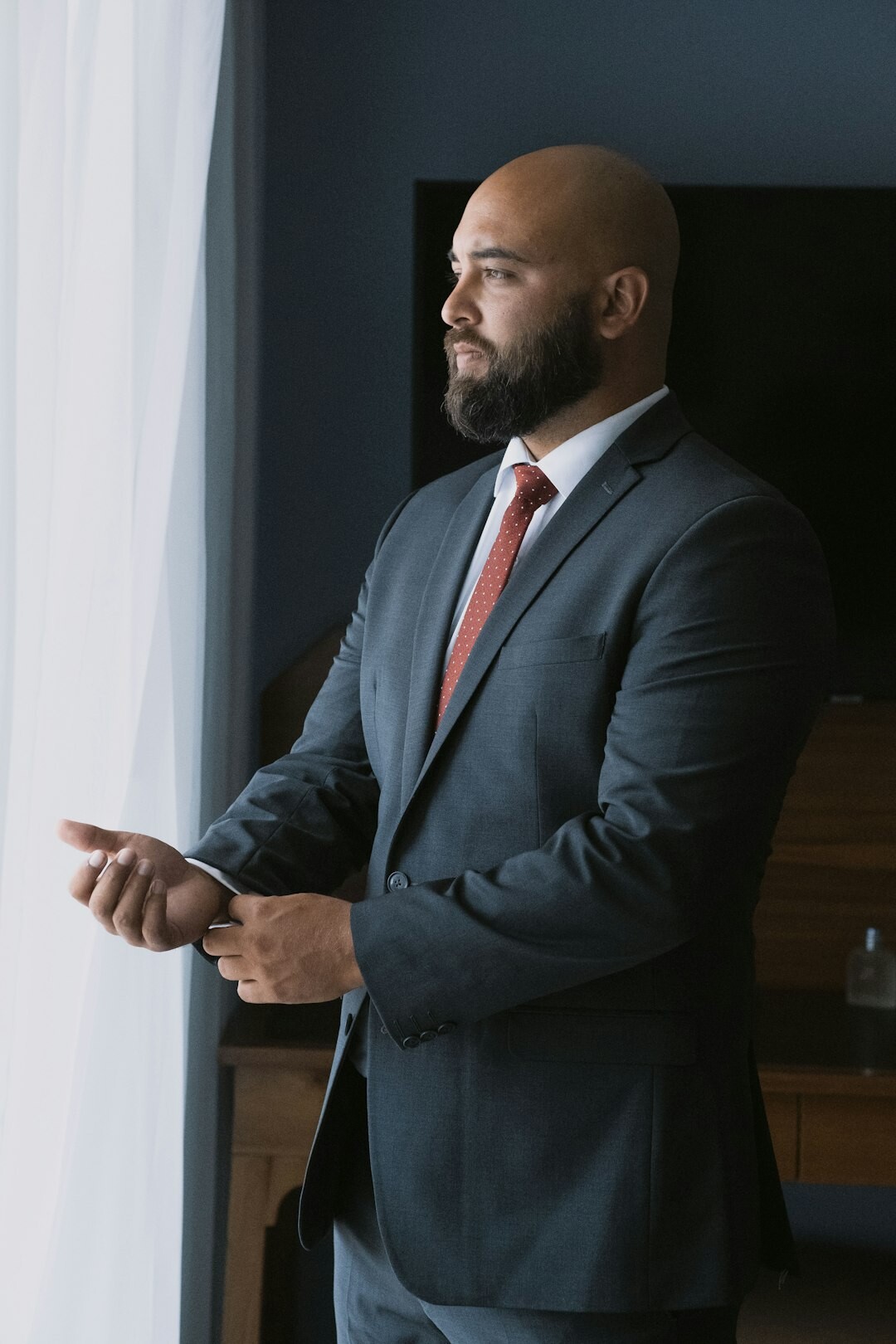 Portrait of a veteran television host in a suit