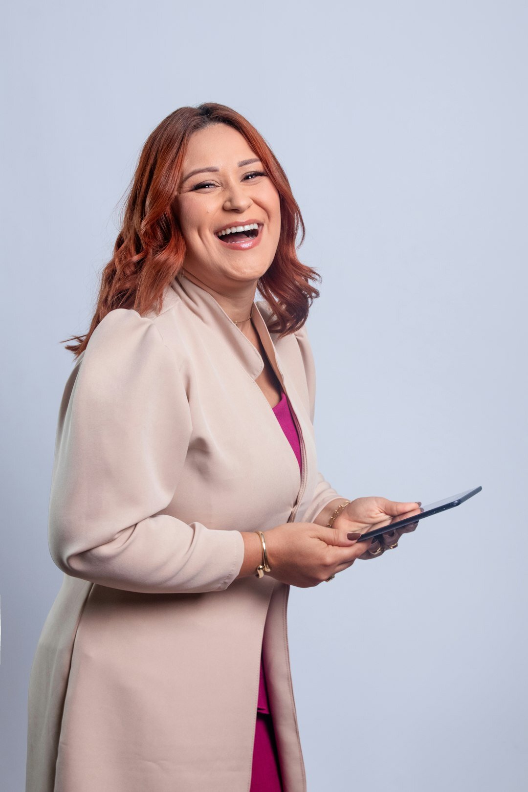 Portrait of a Swiss television presenter smiling in a studio